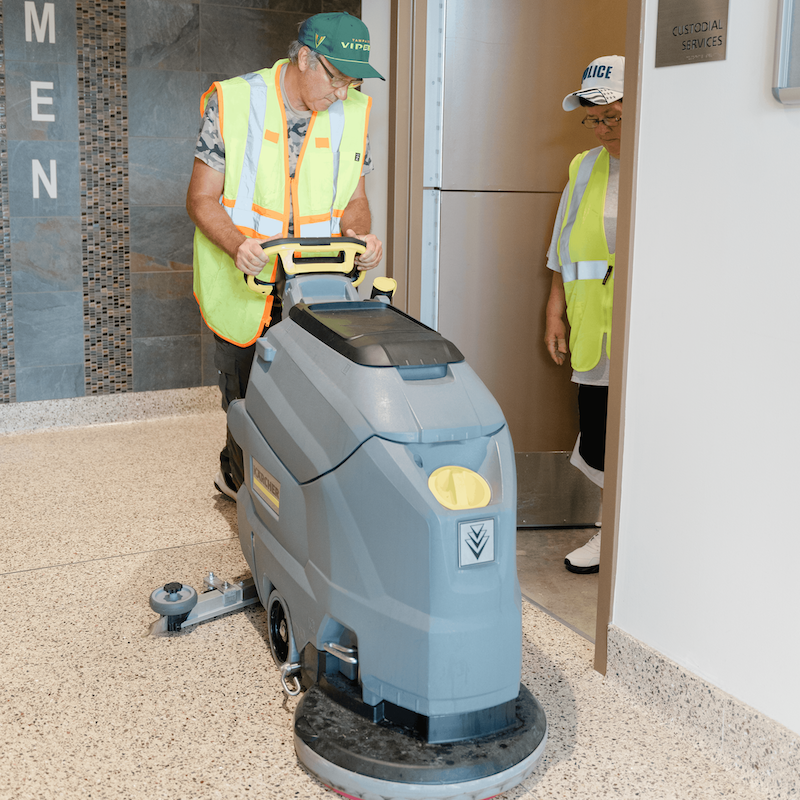 Janitorial Services People smiling at a conference table