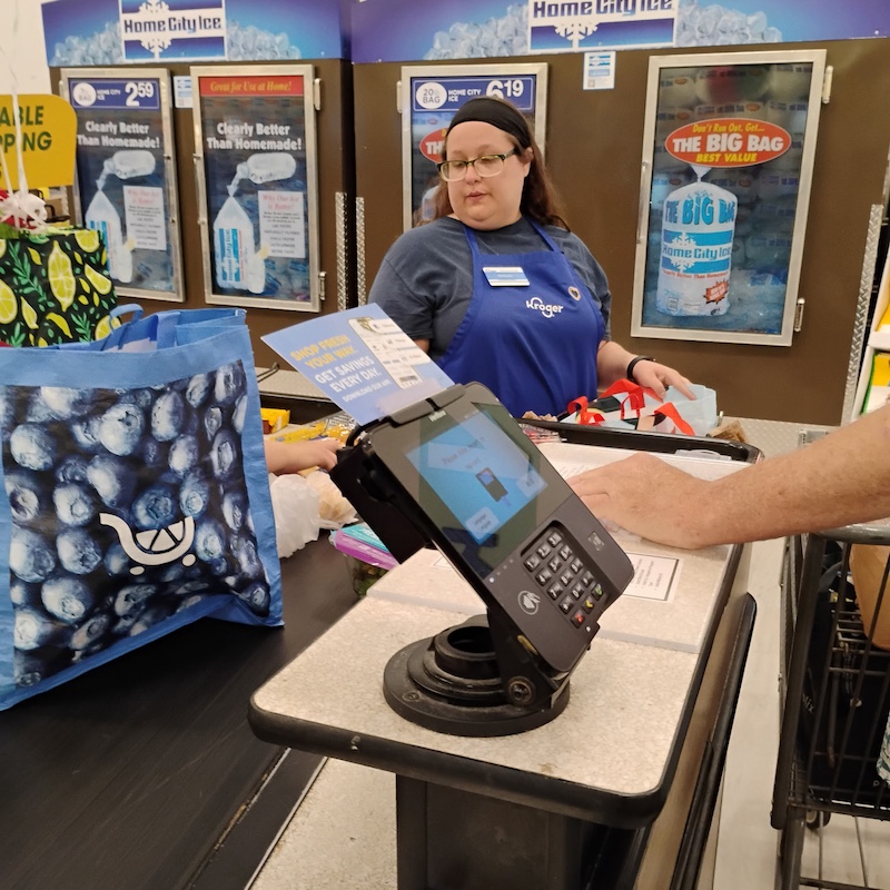 Bagging items at checkout counter