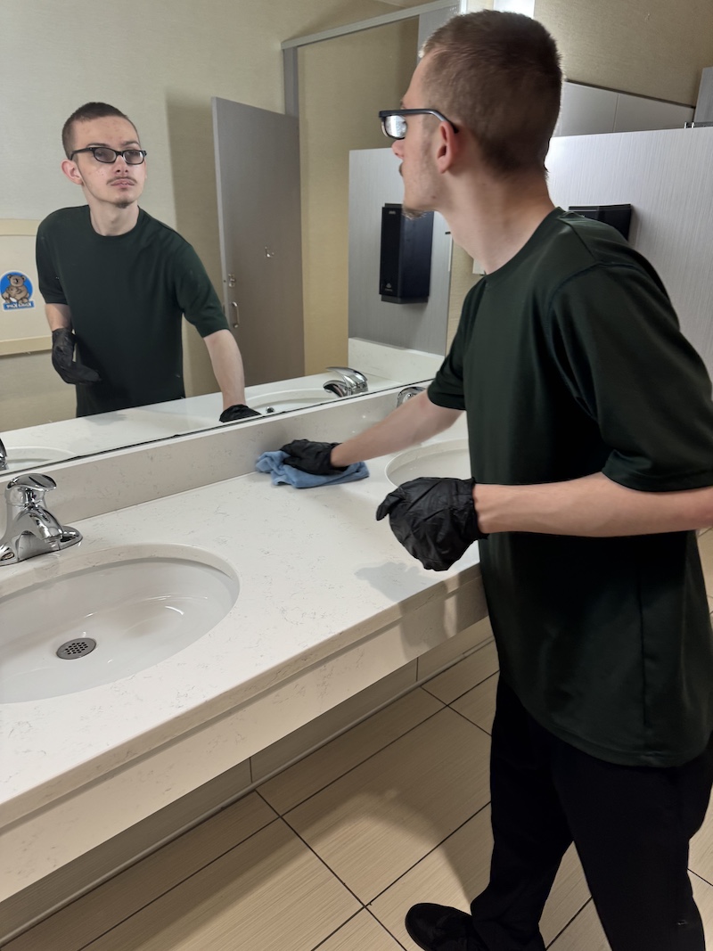 Ryley cleaning a sink